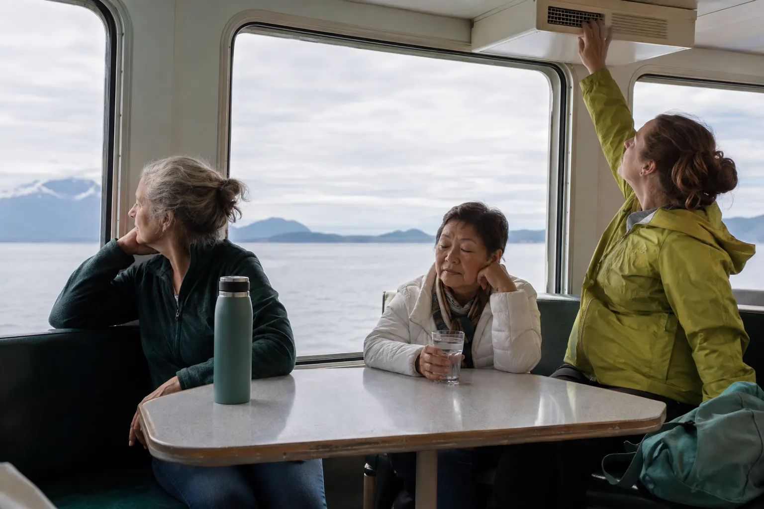 Women of different ages using a horizon view, water and fresh air during a ferry crossing.