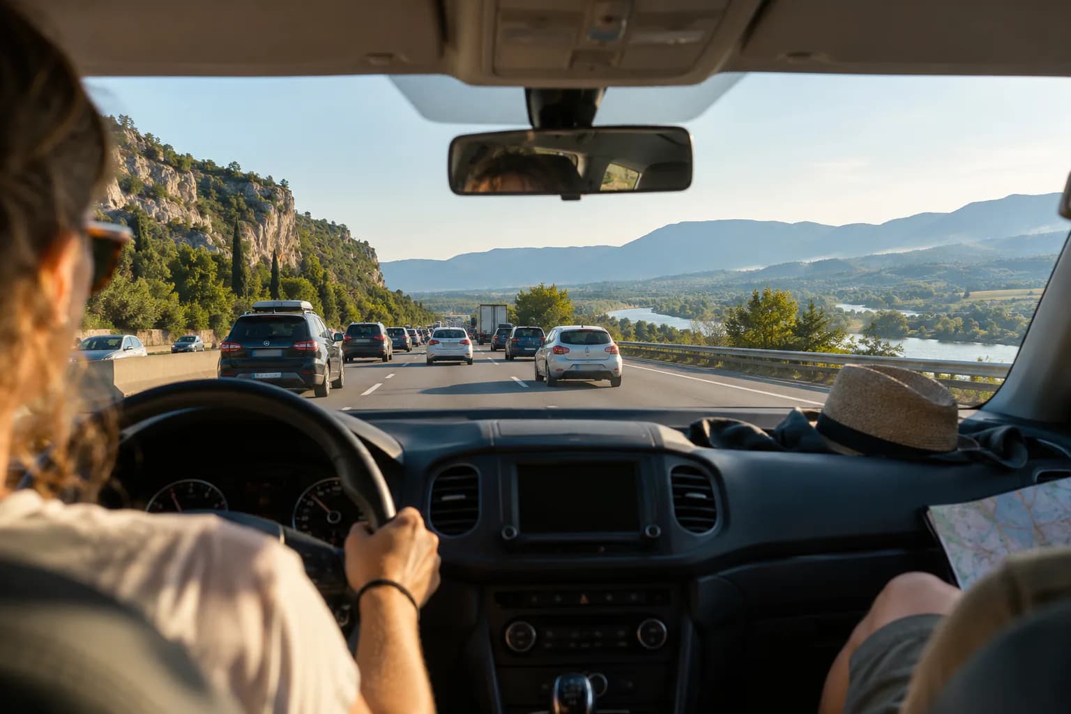 Candid editorial photo for Paris to Nice, of the forward road and horizon from an ordinary passenger viewpoint.