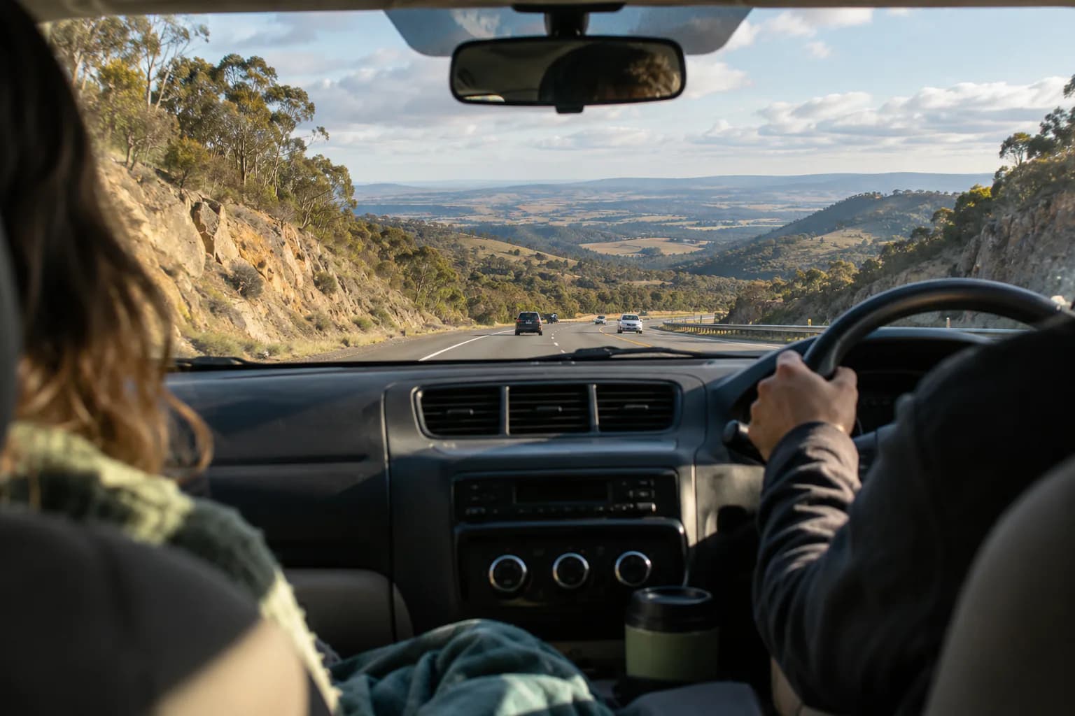 Candid editorial photo for Sydney to Melbourne, of the forward road and horizon from an ordinary passenger viewpoint.